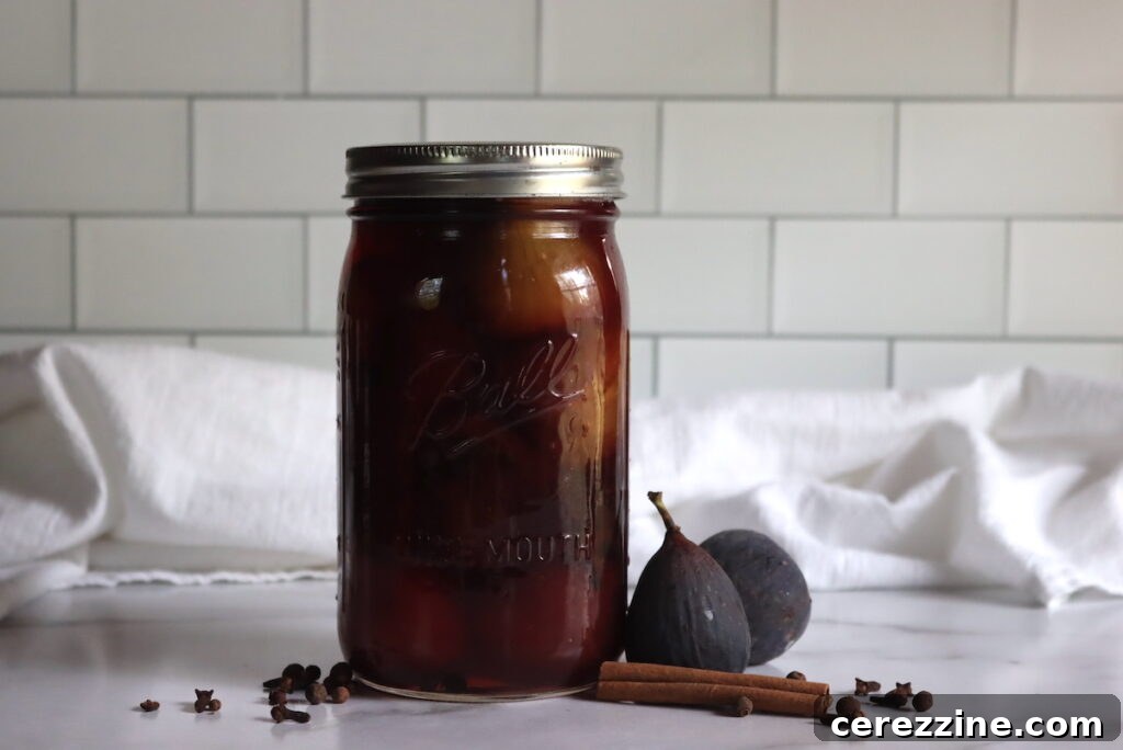 A bowl of old fashioned sweet spiced pickled figs, beautifully presented.