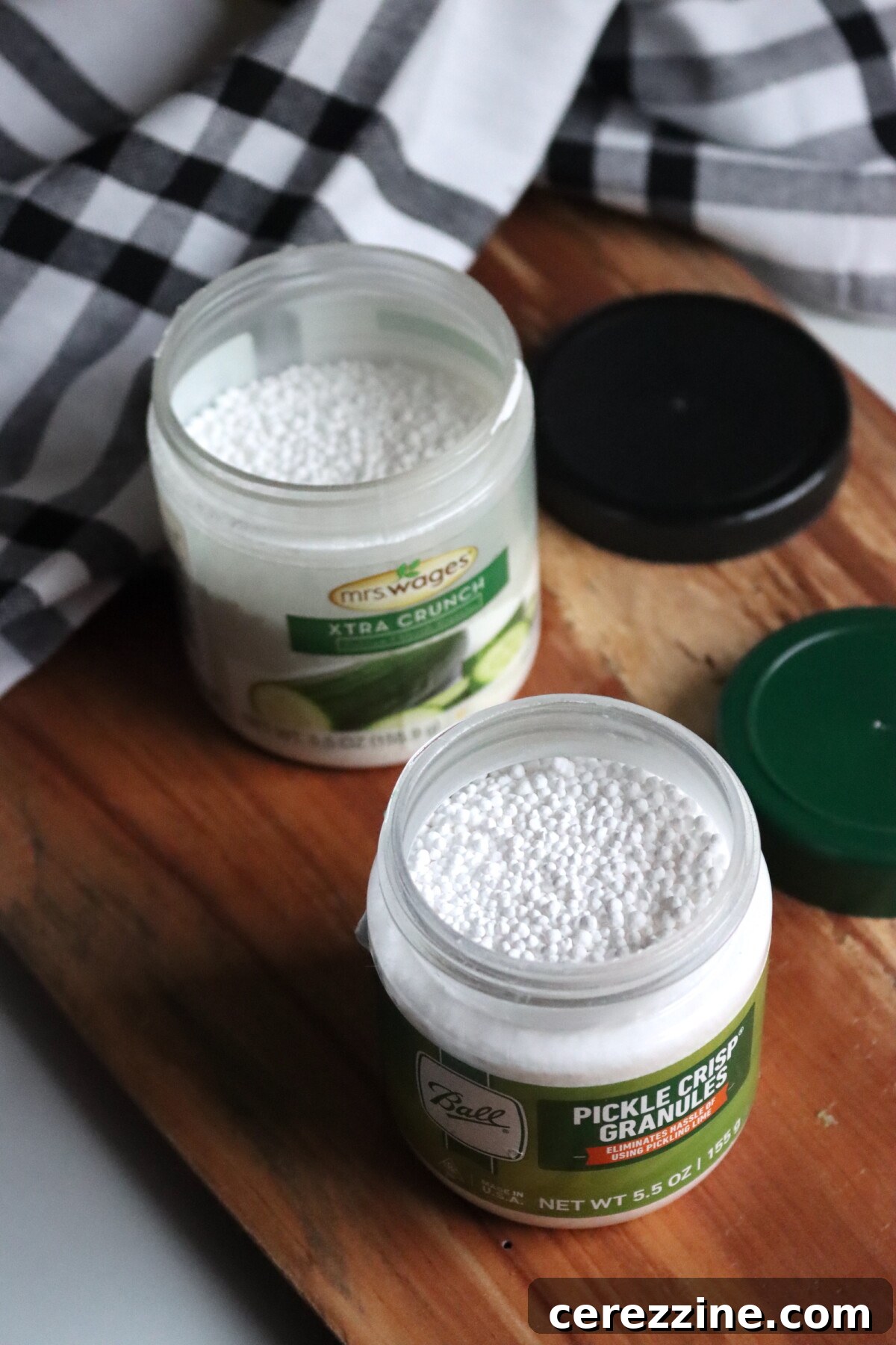 Home Canning Perfection The Calcium Chloride Crunch 4 An open jar of Mrs. Wages Xtra Crunch and another of Ball Canning's Pickle Crisp Granules.