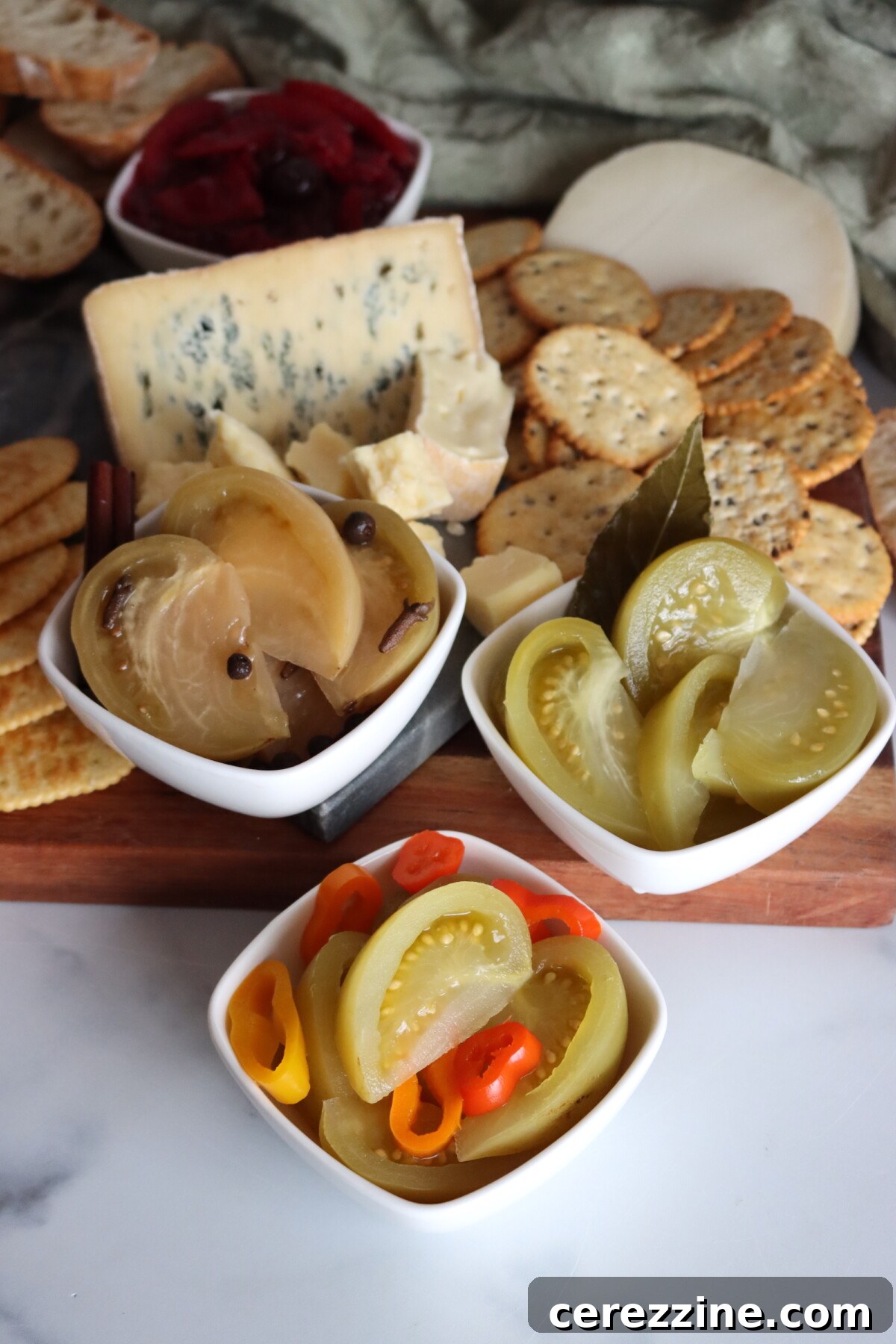 Three types of pickled green tomatoes served on my holiday cheese board.