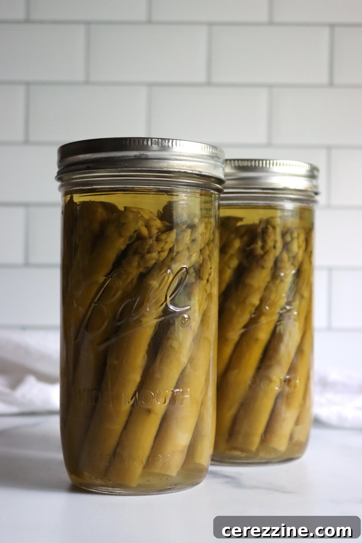 Jars of Canned Asparagus Cooling