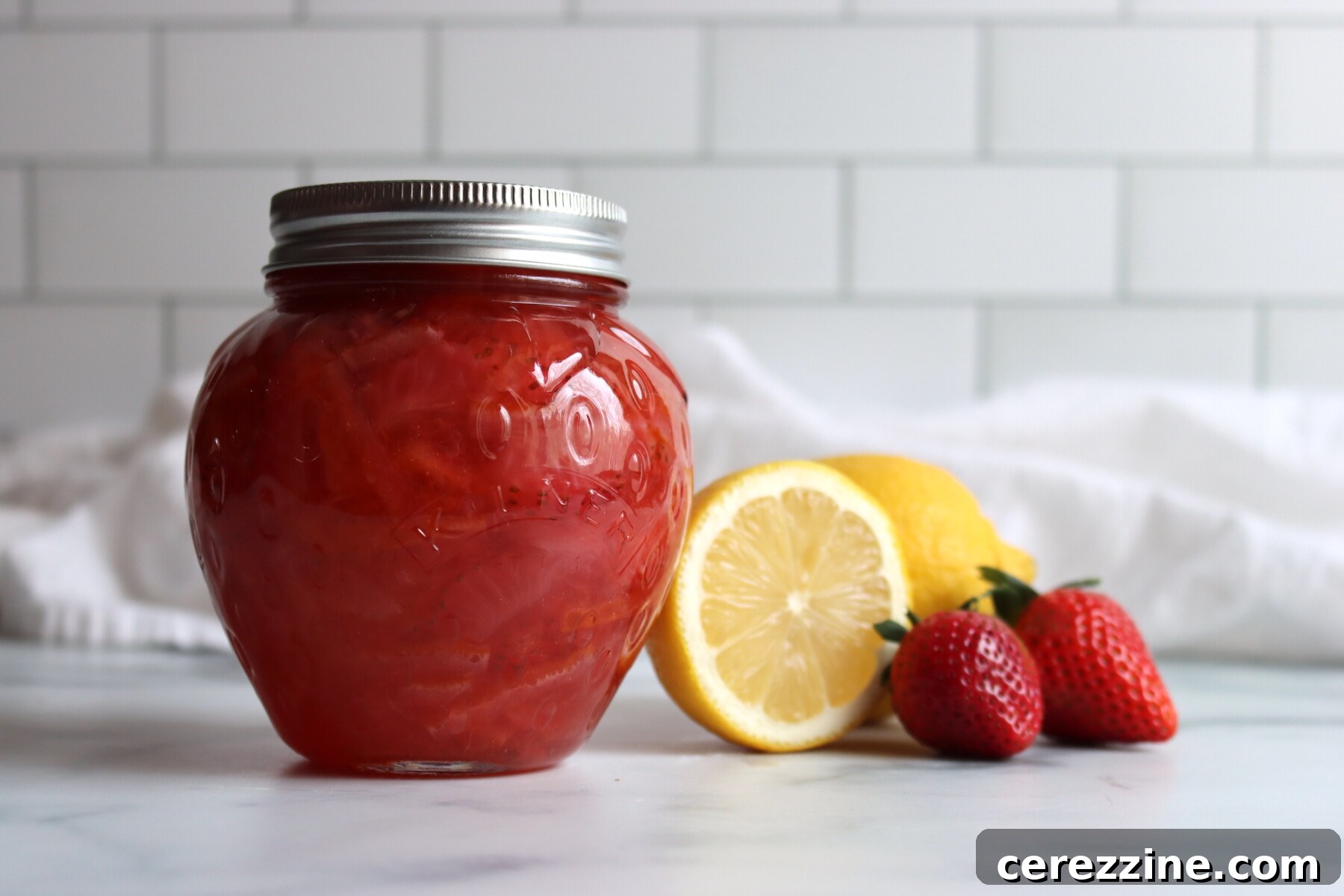 Canning jars filled with homemade Strawberry Marmalade