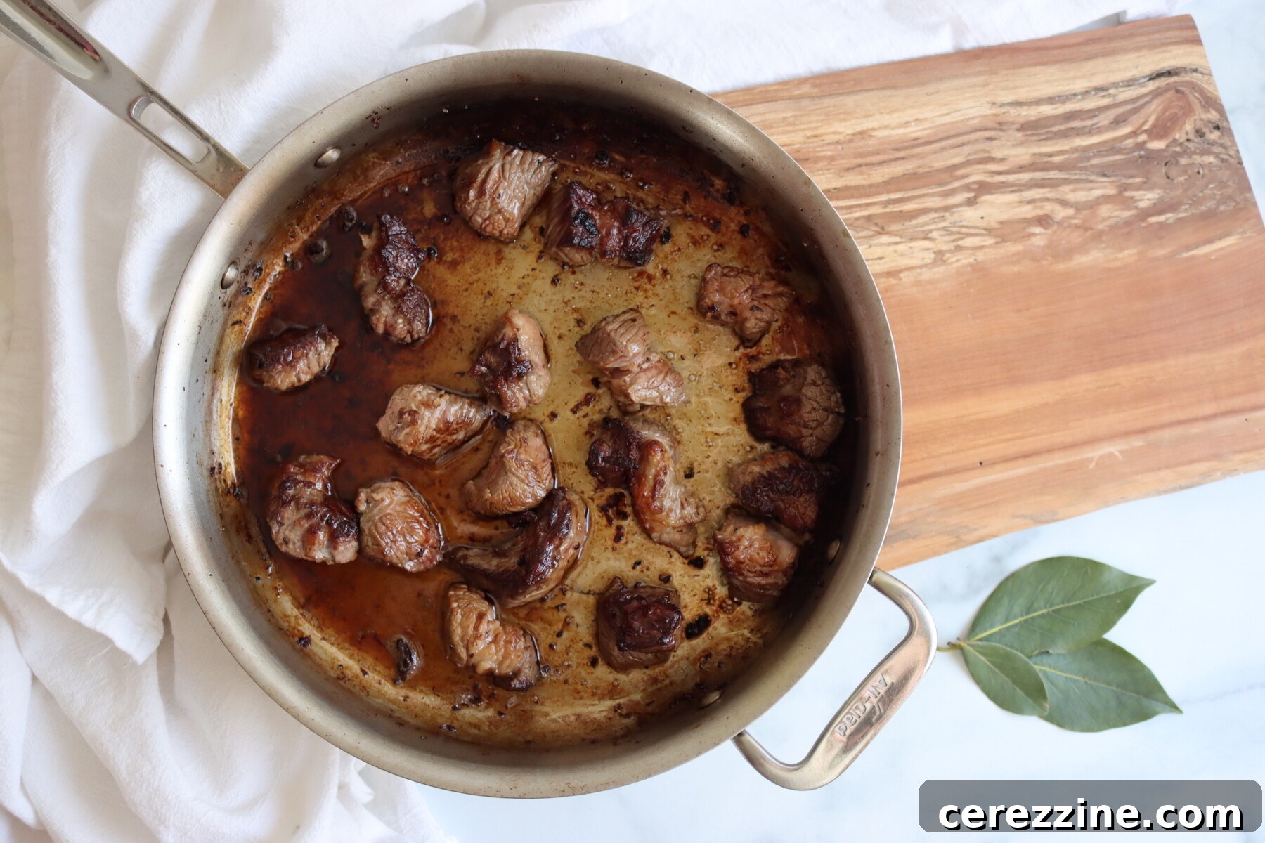 Browning meat in a large pot for beef stew