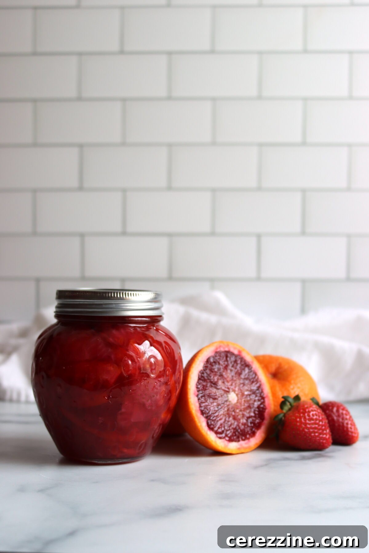 Close-up of Strawberry Blood Orange Marmalade on a piece of toast