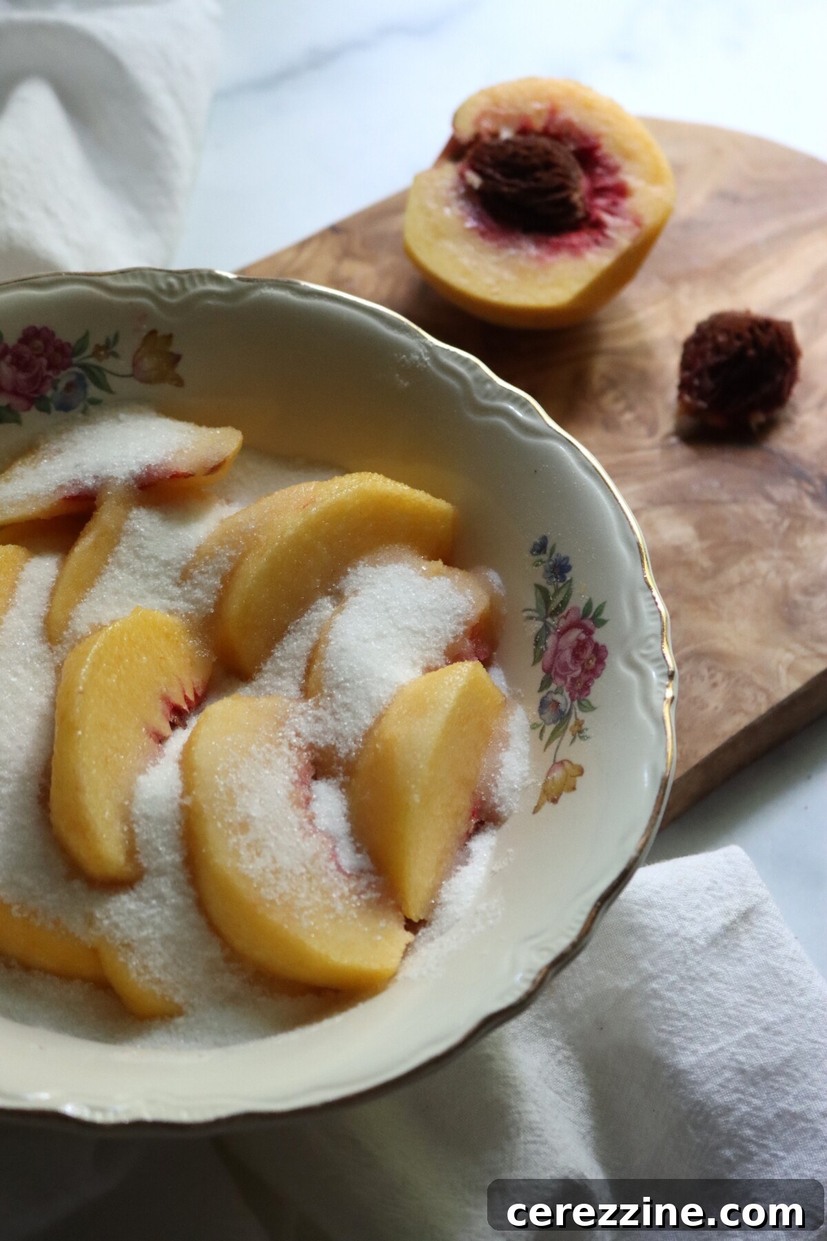 Sliced peaches in sugar for peach preserves