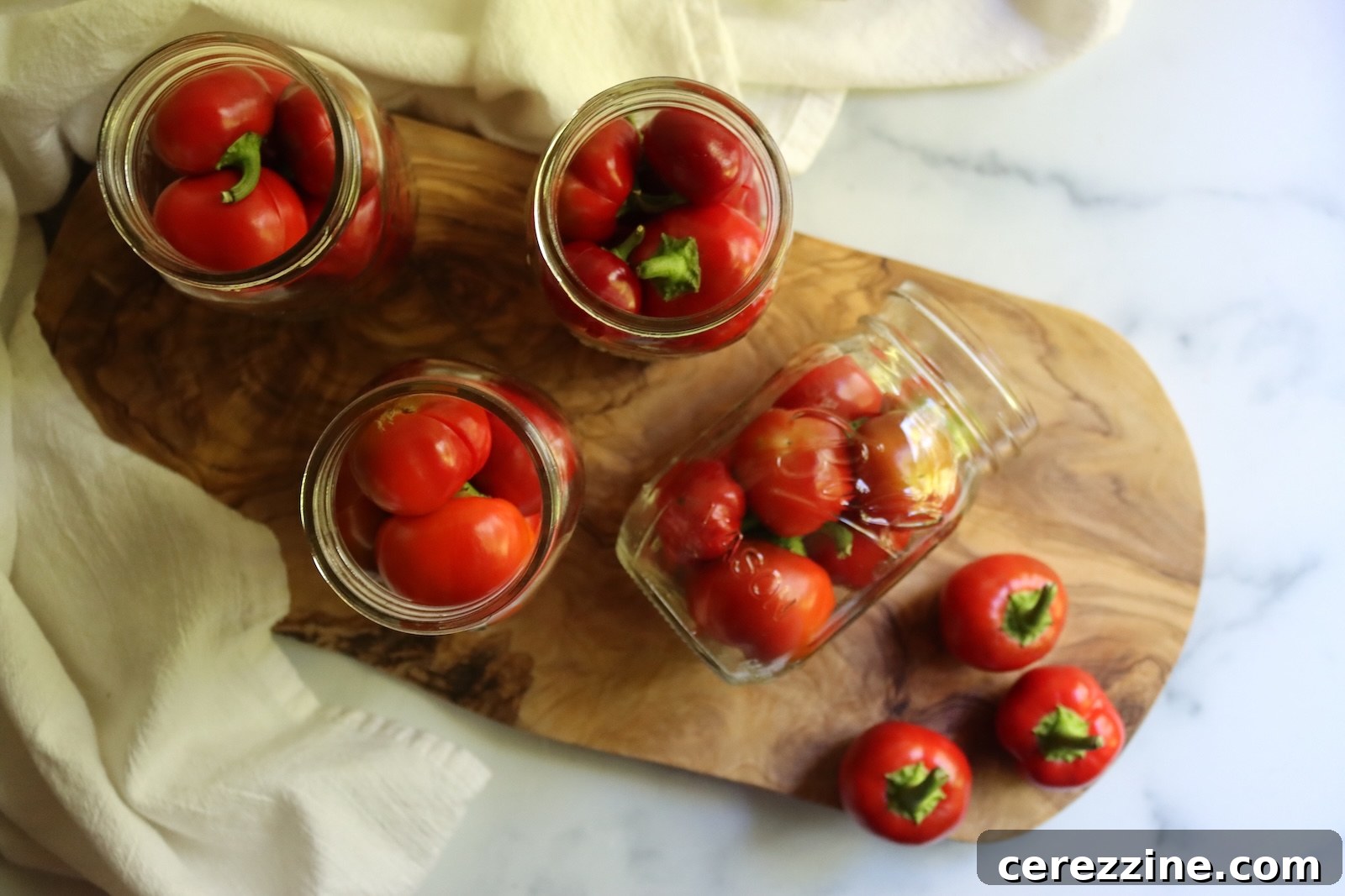 Cherry peppers packed into pint jars before the brine goes in