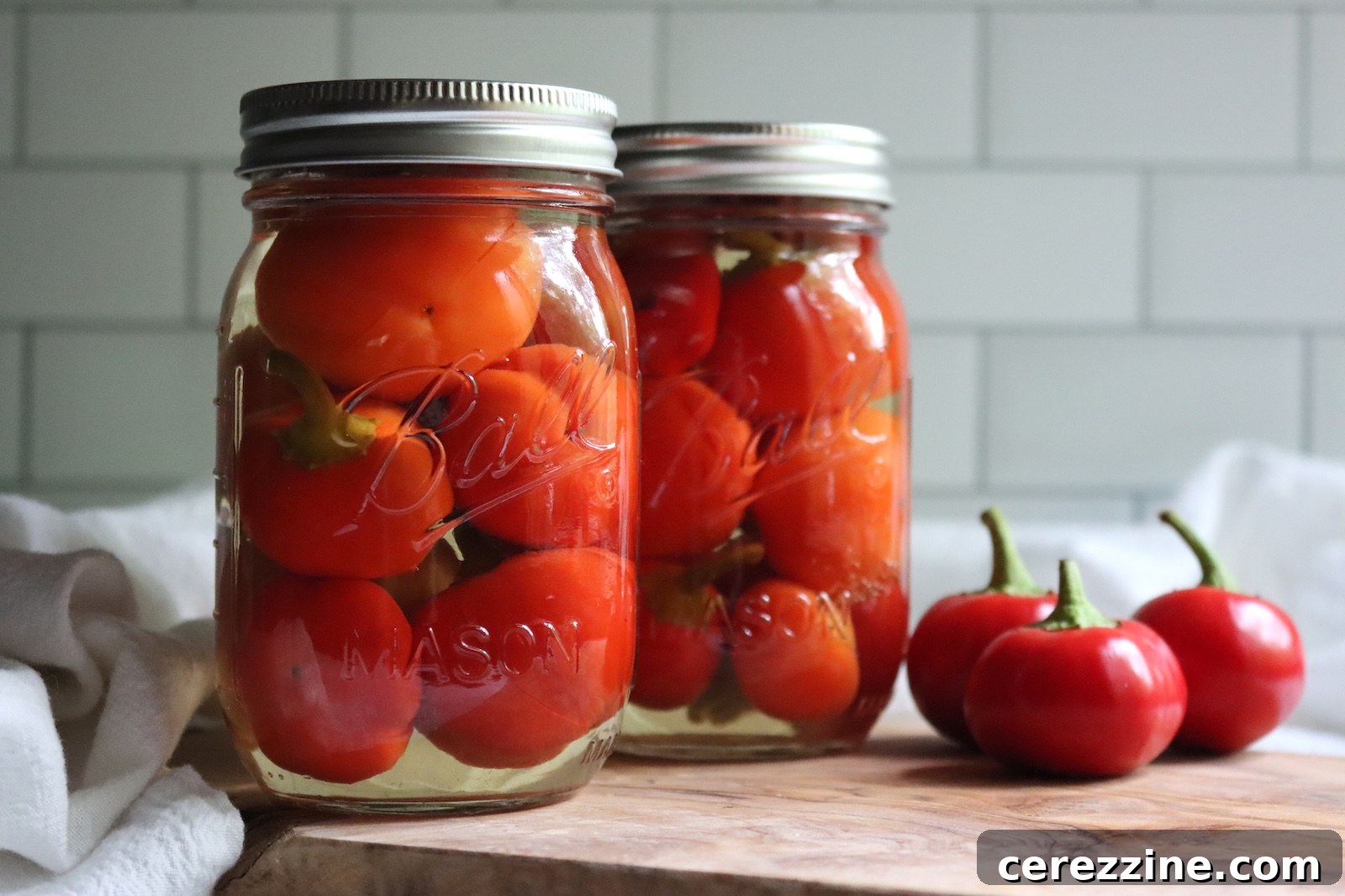 Finished jars of pickled cherry peppers after water bath canning
