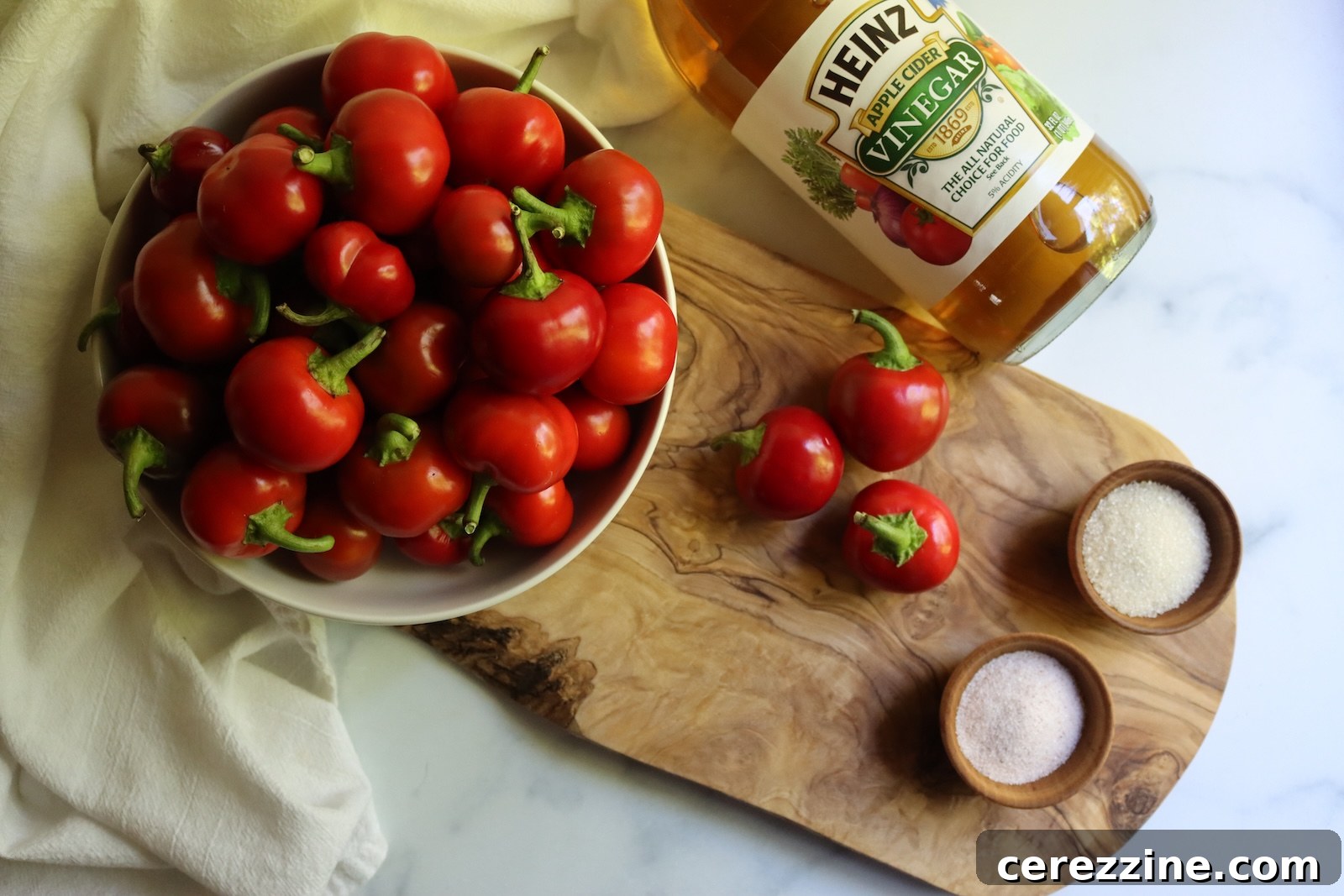 Ingredients for pickled cherry peppers, with cider vinegar, pickling salt, and sugar