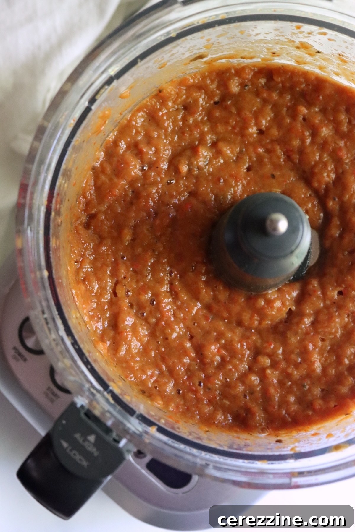 Roasted peppers and eggplant pureed into ajvar in a food processor